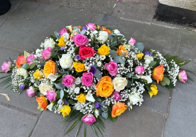 Mixed colour rose and calla casket spray