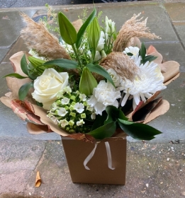 Elegant white hand tied with pampas grass